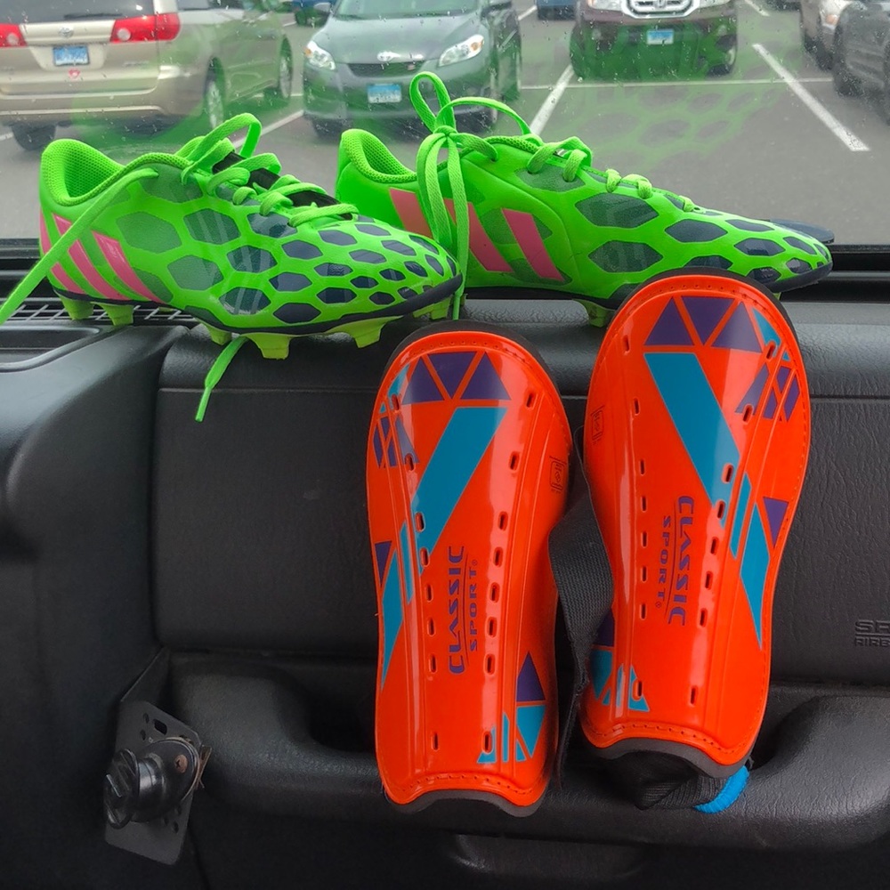 Brand new soccer cleats and shin guards
